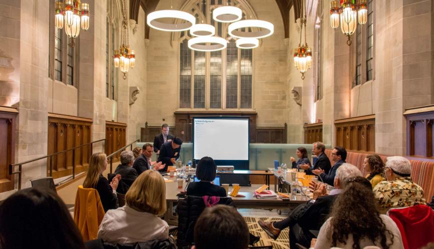 A wide shot of the conference, which took place in the graduate student lounge in Saieh Hall at the University of Chicago.