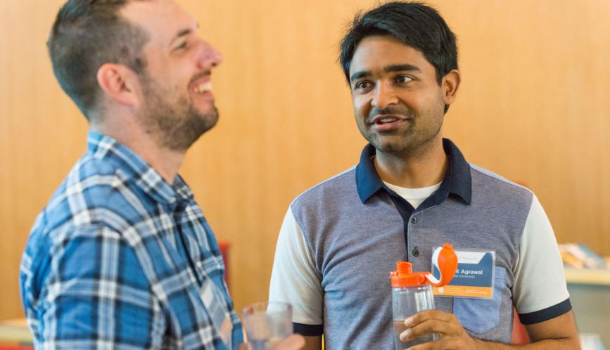 Students are able to connect with others who share their research interests in the field. Pictured are Robert Paul Hartley and Mohit Agrawal 
