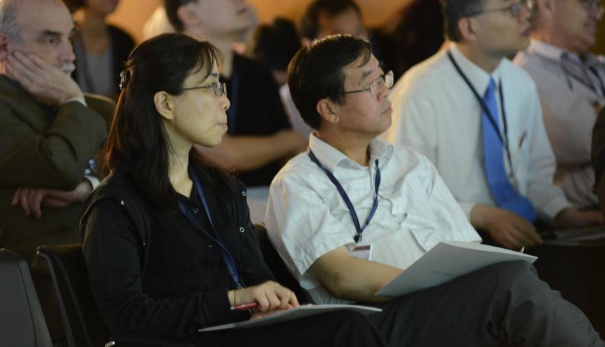 A close up of conference attendees listening to a presentation