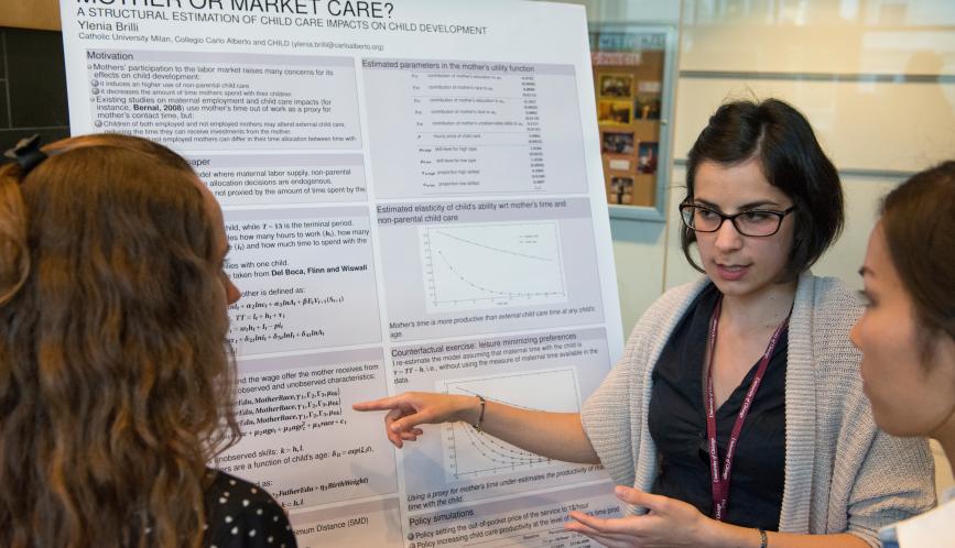 A student presents her work during poster sessions.
