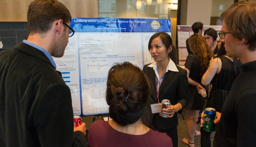 A student presents her work during poster sessions.