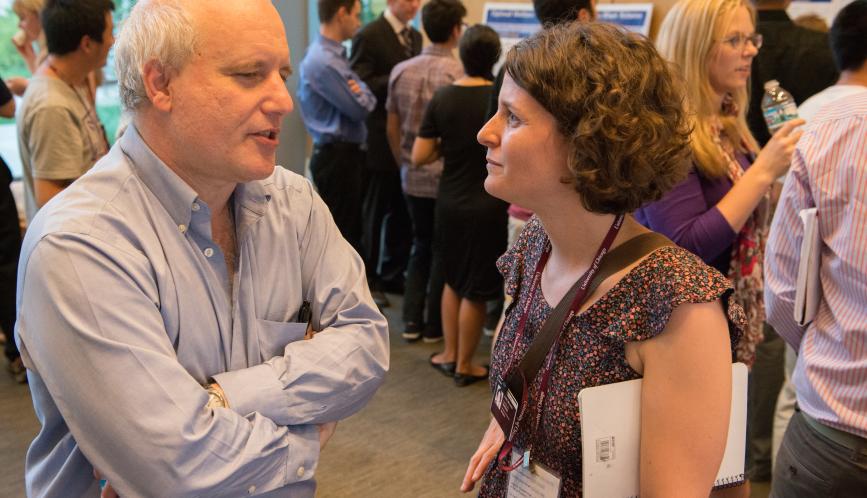 Steven Durlauf in conversation with a student during poster sessions. 