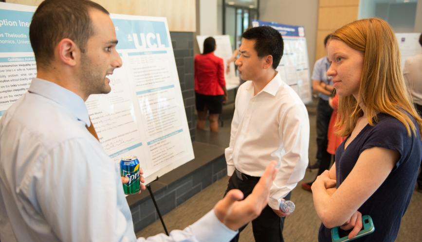 Students in conversation during poster sessions.