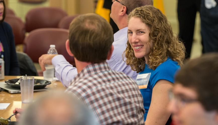 Two conference attendees in conversation.