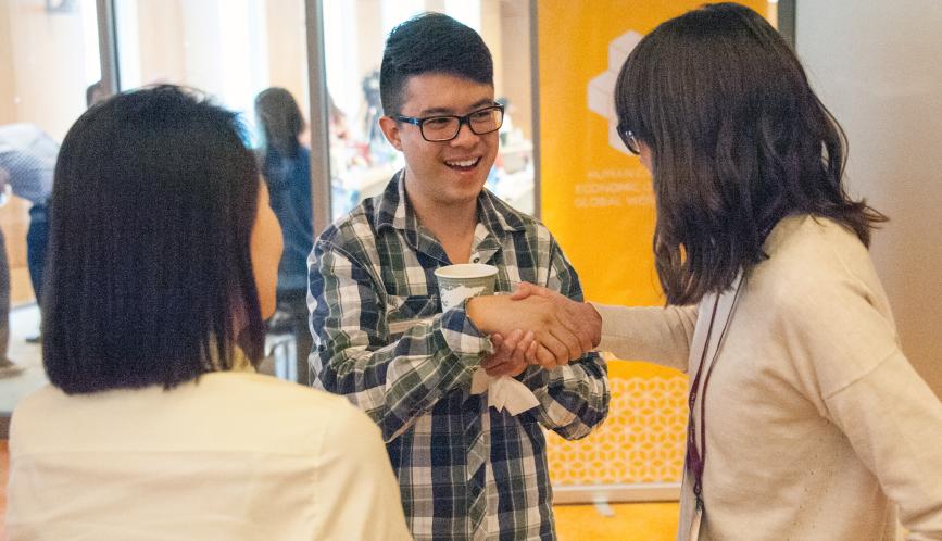 Summer school students in conversation during a break.