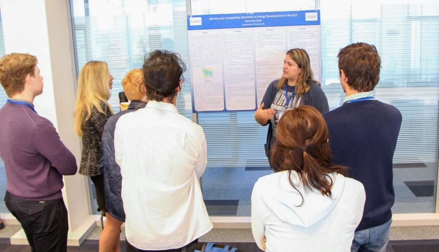 A student presents their work during poster sessions.