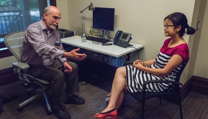Larry Blume meets with a student during office hours.