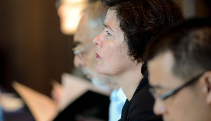 Conference attendees watching a presentation.