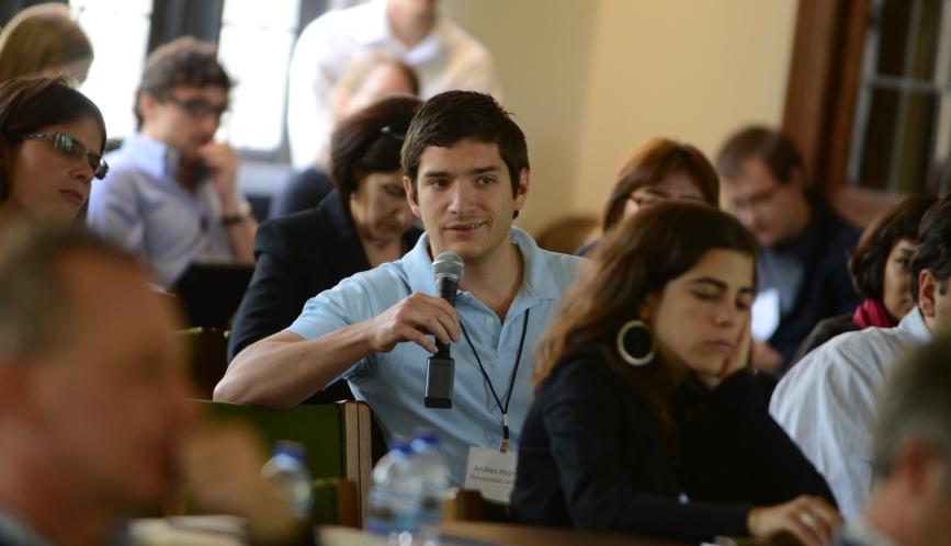 An audience member asking a question of the panelists.