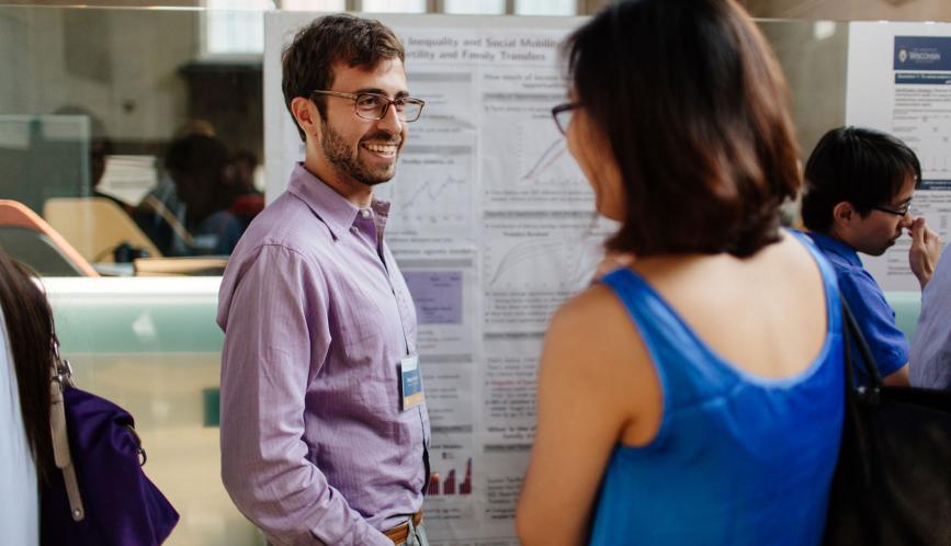 Students in conversation during poster sessions. 