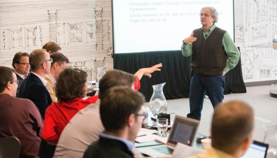 Aldo Rustichini giving a presentation at the conference