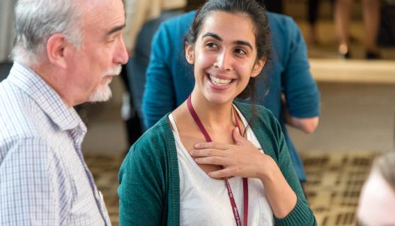 Larry Blume in conversation with a student during poster sessions.