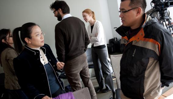 Conference attendees in conversation.